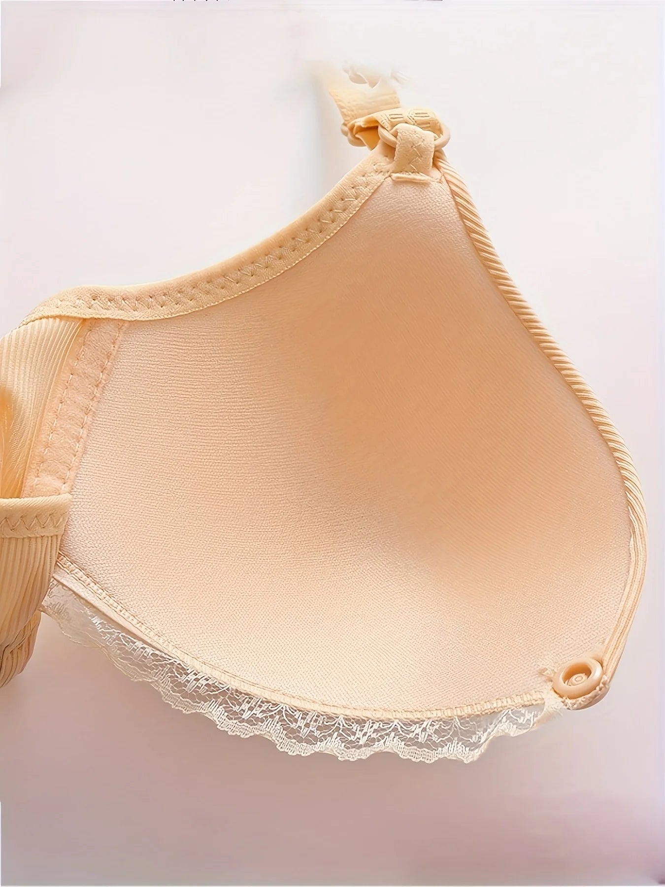 Women's soft supportive wire-free bra with adjustable back closure for lift and shaping featuring a smooth finish